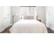 Serene bedroom featuring neutral tones, window blinds, and comfortable bedding for a restful ambiance at 1232 Lucile Sw Ave, Atlanta, GA 30310