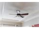 A stylish dark brown ceiling fan with wooden blades against a white coffered ceiling at 1232 Lucile Sw Ave, Atlanta, GA 30310