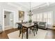 The dining room features a wooden table set for four, a chandelier, and an adjacent seating area at 1232 Lucile Sw Ave, Atlanta, GA 30310