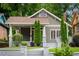 Charming craftsman home with well-kept lawn, complemented by mature landscaping and stone steps at 1232 Lucile Sw Ave, Atlanta, GA 30310