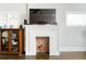 Detailed view of a fireplace with white mantle and brick hearth, offering a cozy focal point at 1232 Lucile Sw Ave, Atlanta, GA 30310