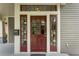 Inviting front door with sidelights and transom, offering a warm and charming entrance to the home at 1232 Lucile Sw Ave, Atlanta, GA 30310
