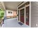 Charming front door with sidelights, transom windows, and a spacious covered porch at 1232 Lucile Sw Ave, Atlanta, GA 30310