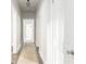 Bright hallway with neutral paint, hardwood floors, and multiple doorways for easy access at 1232 Lucile Sw Ave, Atlanta, GA 30310