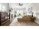 Bright living room with hardwood floors, a fireplace, a ceiling fan and modern furnishings at 1232 Lucile Sw Ave, Atlanta, GA 30310