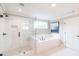 Bathroom featuring a shower and a separate soaking tub with white subway tiles at 2561 Adair Ridge Ct, Decatur, GA 30034