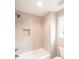 Bright bathroom features tiled walls, a modern bathtub, and natural light at 2561 Adair Ridge Ct, Decatur, GA 30034