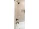 Modern bathtub with rainfall shower head and beautiful tile surround in this bathroom at 2561 Adair Ridge Ct, Decatur, GA 30034