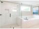 Bathroom featuring a shower and a separate soaking tub with white subway tiles at 2561 Adair Ridge Ct, Decatur, GA 30034