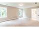 Spacious bedroom with carpeted floors, abundant natural light, and an attached bathroom at 2561 Adair Ridge Ct, Decatur, GA 30034