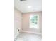 Bright laundry room with patterned floors, a window, and ample space at 2561 Adair Ridge Ct, Decatur, GA 30034