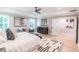 A cozy main bedroom with a tray ceiling, an area rug, neutral walls, and bright windows at 2561 Adair Ridge Ct, Decatur, GA 30034