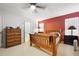 Inviting bedroom with a wooden bed frame, ample natural light, and a functional layout at 3620 Darwin Pl, Duluth, GA 30096