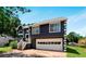 Charming two-story home featuring a gray exterior, attached garage, and a welcoming front porch at 3620 Darwin Pl, Duluth, GA 30096