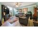 Cozy living room with wood-look flooring, a ceiling fan, and comfortable seating at 3620 Darwin Pl, Duluth, GA 30096
