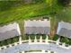 Overhead shot of townhomes with well-manicured lawns in a neighborhood with curved streets at 5843 Taka Ln, Lithonia, GA 30038