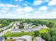 Beautiful aerial view of townhome community surrounded by lush greenery and a picturesque landscape at 5843 Taka Ln, Lithonia, GA 30038