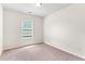 Bedroom with natural light and plush carpeting at 5843 Taka Ln, Lithonia, GA 30038