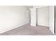 Bedroom with neutral carpet and a closet with a door open for lots of storage options at 5843 Taka Ln, Lithonia, GA 30038