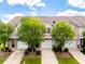 A charming townhome with a well-maintained lawn and driveway leading to the garage at 5843 Taka Ln, Lithonia, GA 30038