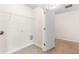 View of laundry room with vinyl floors and wire shelving at 5843 Taka Ln, Lithonia, GA 30038