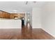 Bright living area with hardwood floors, neutral walls, and a view of the kitchen at 5843 Taka Ln, Lithonia, GA 30038