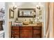 Bathroom vanity featuring a vessel sink, warm lighting, and tiled backsplash at 1263 Blueberry Trl, Decatur, GA 30033