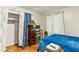 Comfortable bedroom with a large closet, wood floors, and a TV for relaxation at 1263 Blueberry Trl, Decatur, GA 30033