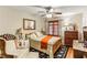 Cozy bedroom with ceiling fan, wood floors, and decorative accents, creating a warm and inviting space at 1263 Blueberry Trl, Decatur, GA 30033