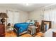 Bright bedroom with hardwood floors, a comfortable bed, and sheer curtains offering natural light at 1263 Blueberry Trl, Decatur, GA 30033