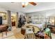 Large bedroom with en-suite bathroom, bright windows, a ceiling fan, and unique decor at 1263 Blueberry Trl, Decatur, GA 30033