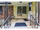 Inviting front porch with decorative railings and a seating area for relaxing at 1263 Blueberry Trl, Decatur, GA 30033