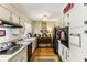 Efficient kitchen with white cabinets and appliances, offering ample storage and counter space at 1263 Blueberry Trl, Decatur, GA 30033