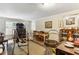 Bright living room with hardwood floors, a sitting area, and lots of light from large windows at 1263 Blueberry Trl, Decatur, GA 30033