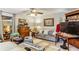 Cozy living room showcasing a sofa, a television, and a ceiling fan for comfort and entertainment at 1263 Blueberry Trl, Decatur, GA 30033