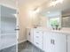 Bathroom with double sink vanity, sleek countertops, and modern fixtures at 1731 Fulmont Cir, Mableton, GA 30126