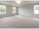 Large bedroom featuring neutral carpeting and ample natural light from multiple windows at 1731 Fulmont Cir, Mableton, GA 30126