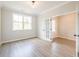 Bedroom features modern flooring, neutral paint, large window, and an open doorway at 1731 Fulmont Cir, Mableton, GA 30126
