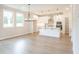 Eat in kitchen featuring white cabinets, stainless steel appliances, island, and pendant lighting at 1731 Fulmont Cir, Mableton, GA 30126