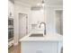 Bright kitchen featuring a large island, stainless steel appliances, and modern finishes at 1731 Fulmont Cir, Mableton, GA 30126