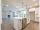 Open kitchen with stainless steel appliances, quartz countertops, and an island sink at 1731 Fulmont Cir, Mableton, GA 30126