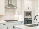 Modern kitchen features stainless steel appliances, white cabinets, and stylish backsplash at 1731 Fulmont Cir, Mableton, GA 30126