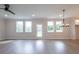 Spacious living room featuring modern flooring, recessed lighting, and large windows overlooking the yard at 1731 Fulmont Cir, Mableton, GA 30126