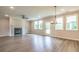 Open-concept living room features a fireplace, modern flooring, and ample natural light at 1731 Fulmont Cir, Mableton, GA 30126