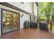 Spacious deck overlooking the yard with outdoor cooking space and view into the dining room at 410 Sheringham Ct, Roswell, GA 30076