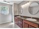 Bathroom boasts dual sinks, ample counter space and modern fixtures at 410 Sheringham Ct, Roswell, GA 30076