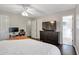 Spacious bedroom with wood floors, a ceiling fan, and an ensuite bathroom at 410 Sheringham Ct, Roswell, GA 30076