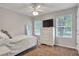 Bedroom featuring a ceiling fan, natural light, and neutral paint at 410 Sheringham Ct, Roswell, GA 30076