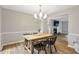 The dining room includes updated floors, neutral paint and an open view into the living room at 410 Sheringham Ct, Roswell, GA 30076