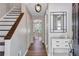 Welcoming entryway with hardwood floors, staircase, and modern décor at 410 Sheringham Ct, Roswell, GA 30076